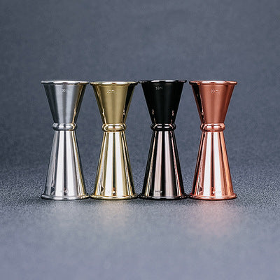 Cocktail bar gadget set featuring graduated glassware for precise measuring and mixing of drinks.
