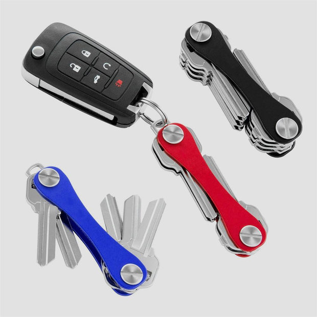 Compact metal key holder and keychain container for organized and secure gadget storage.
